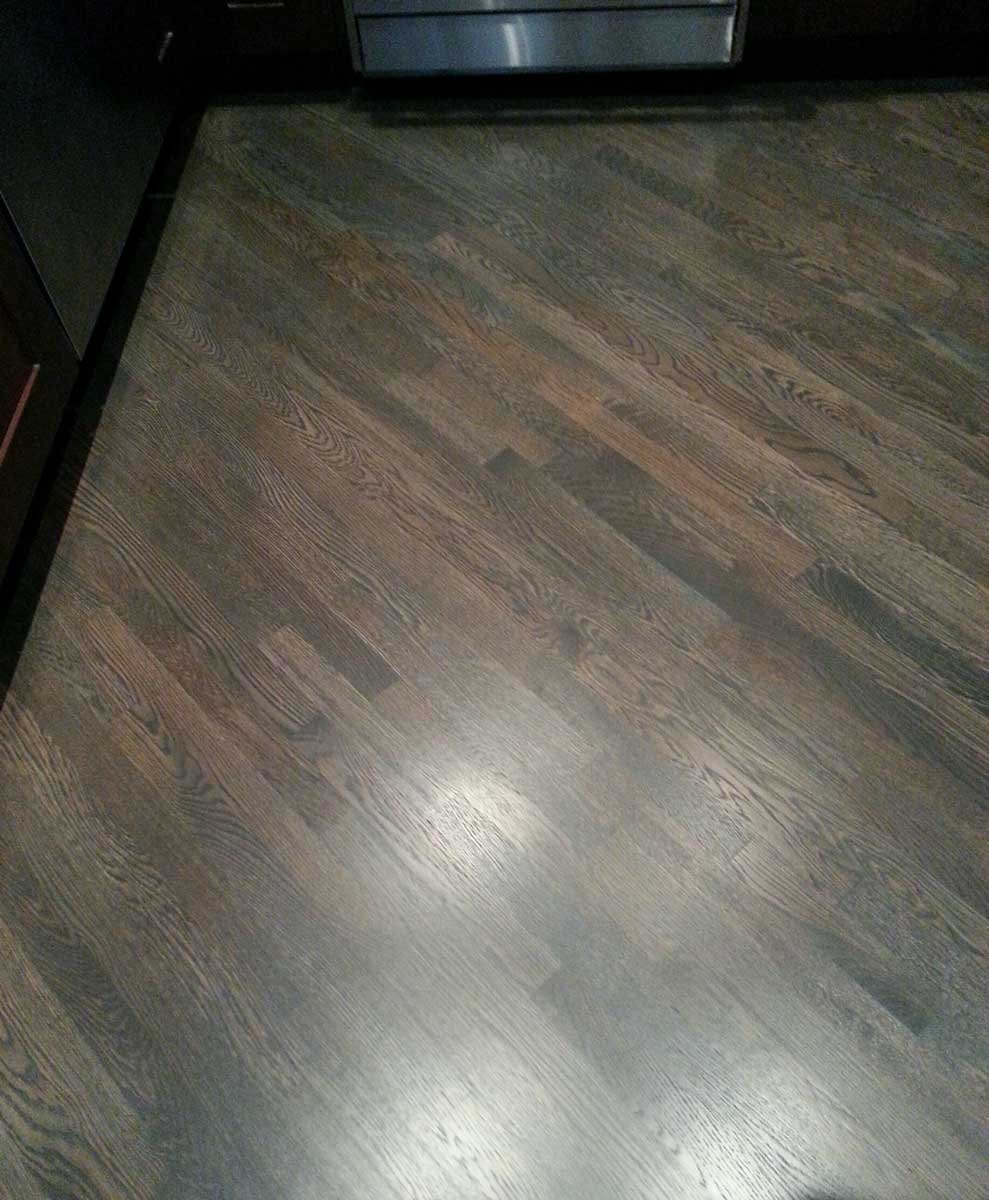 Custom grey stain with a red oak wood floor on a 45 degree angle